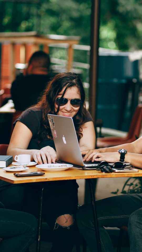 photo of three person sitting and talking